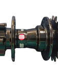 A used bicycle hub with a black multi-gear rear wheel side and a dark metallic brown front side.