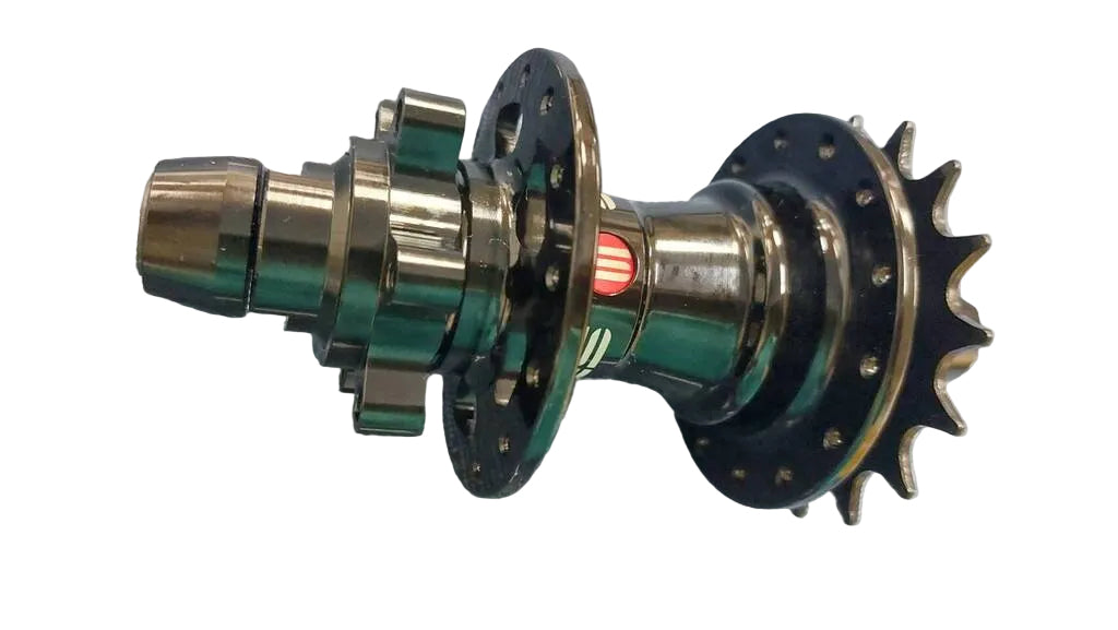 A metal bicycle hub component with a black multi-sprocket rear wheel side and a polished silver front spindle.
