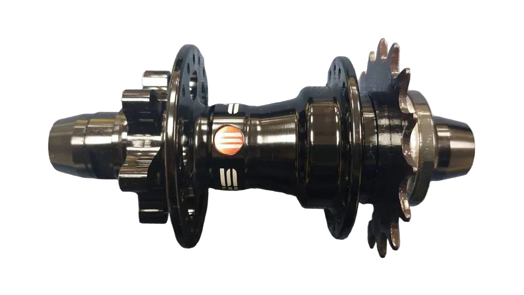 A used black bicycle hub with a small orange and white logo.