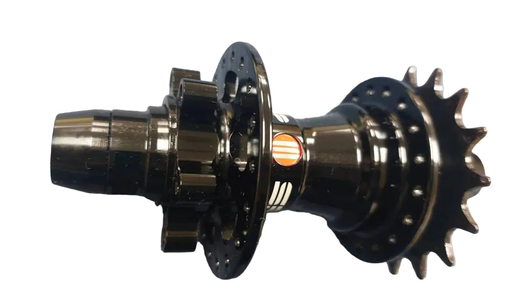 A close-up of a black bicycle hub component with a rear sprocket and front cogs.