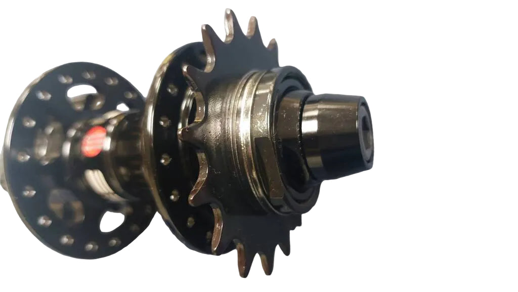 A close-up of a bicycle hub component with a black multi-sprocket rear wheel and  front freehub body.