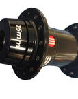 A close-up of a bicycle hub component with a black flange, a  center section marked '15mm', and a small red accent ring.