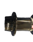 A black bicycle hub with '15mm' printed in white on one side and a red accent ring,.