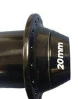 A close-up of a black bicycle hub with '20mm' printed in white on its side.