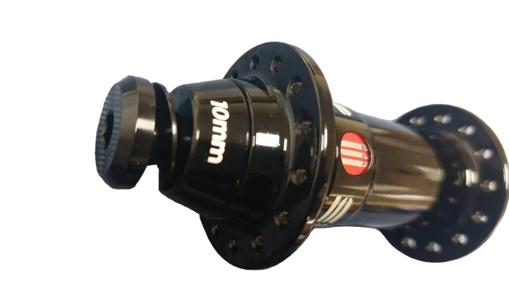 A close-up of a black 10mm bicycle hub with a small red and white logo,.
