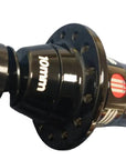 A close-up of a black 10mm bicycle hub with a small red and white logo,.