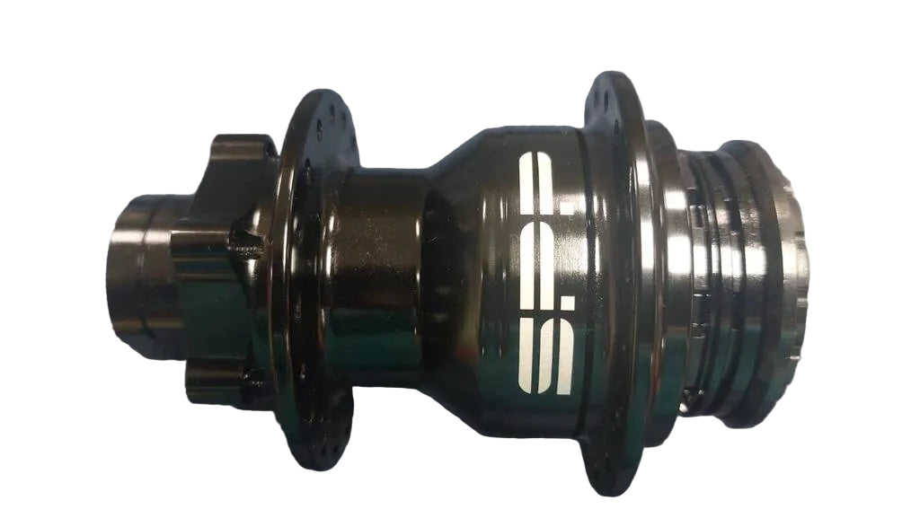 A dark metallic bicycle hub with a white 'S.P.' logo,