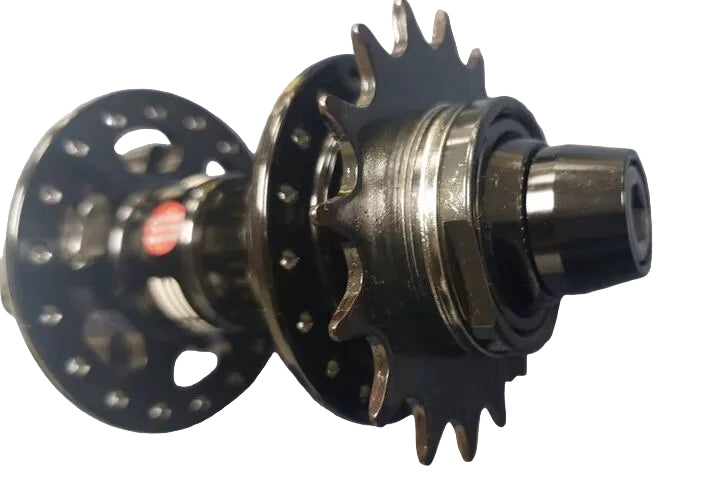 A close-up of a bicycle hub component with a black multi-spoke wheel disc.