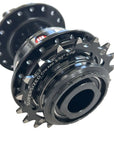 Close-up of a black bicycle hub with visible text reading 'SUPER SIZED Cro Mo 3/32" Cog' on the side.
